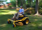 Chandler&#39;s Lawn Service 3 copy  Chandler Gossett, 16, cuts the grass at a client&#39;s home in Spartanburg Tuesday afternoon, 5-1-07. The teenager and his father, Robby, of Roebuck, work together in his business, &#34;Chandler&#39;s Lawn Service&#34;.